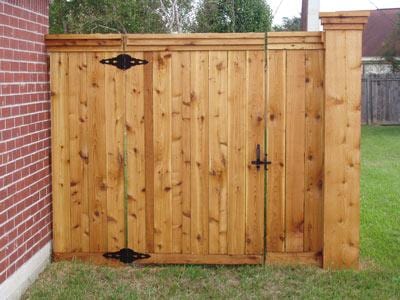 Cedar privacy fence double gate with decorative hinges