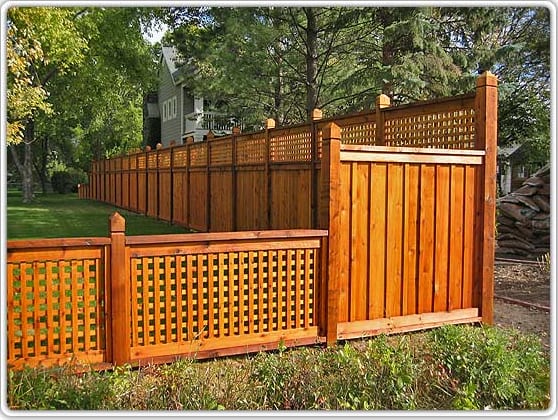 Wood privacy fence with lattice top and matching gate panels